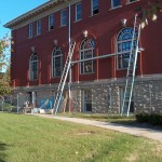 Cleaning the Repointed Brick on the South Wall