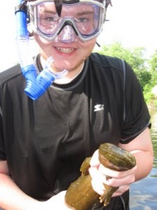 Summer Creek Camper with a Hellbender salamander.