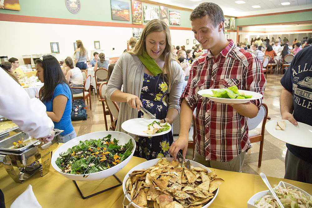 Students enjoying local food